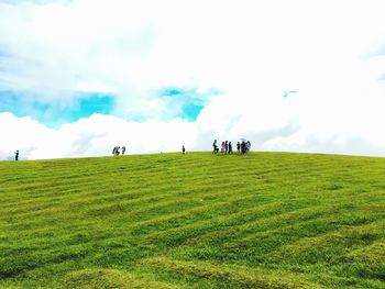 People on field against sky