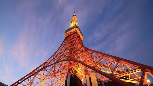 Low angle view of illuminated tokyo tower against sky