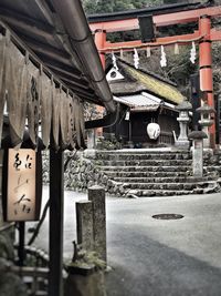 Clothes hanging on roof against temple