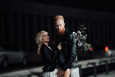 Young couple looking at camera