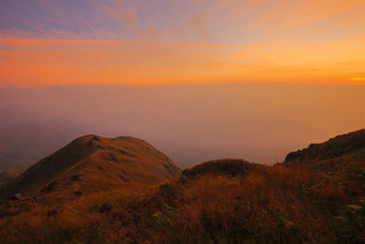 Scenic view of mountains against sky during sunset