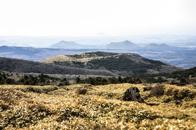 Countryside landscape against clear sky