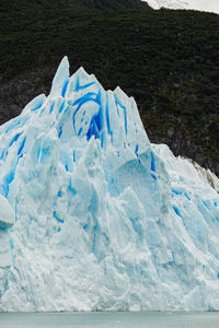 Low section of woman standing on snow