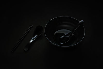 High angle view of wineglass on table against black background