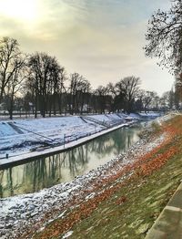 Frozen lake against sky during winter