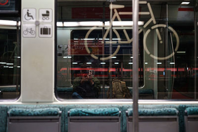 Rear view of people in train