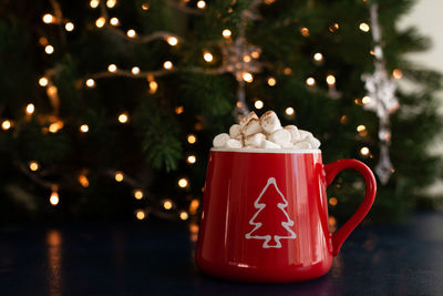 Illuminated christmas tree on table