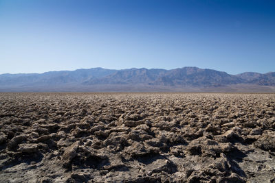 Scenic view of arid landscape against clear sky