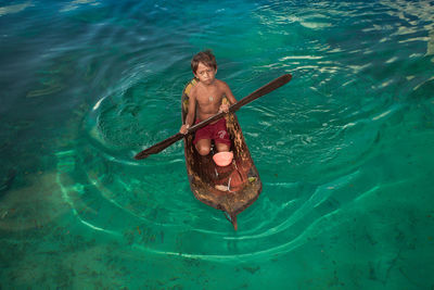 High angle view of man swimming in sea