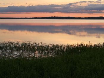 Scenic view of lake against sky during sunset