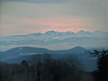 Scenic view of mountains against sky during sunset