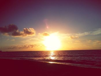 Scenic view of sea against sky at sunset