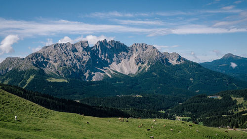 Scenic view of landscape and mountains against sky