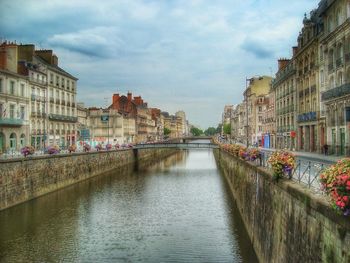 View of canal with buildings in background