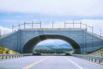 Driving into a tunnel on a clear day in denver, colorado