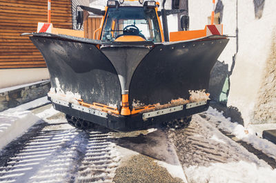 High angle view of snowplow in city during winter