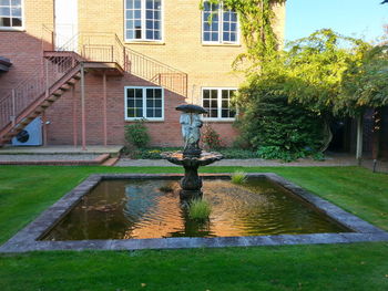 Reflection of buildings in pond