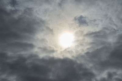 Low angle view of sun in sky