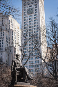 Statue against buildings in new york city