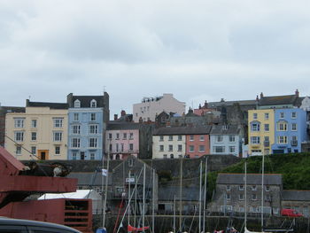 Houses in city against sky