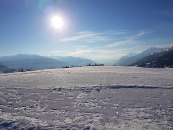Scenic view of snowcapped mountains against sky