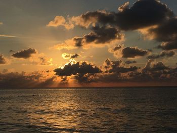 Scenic view of sea against sky at sunset