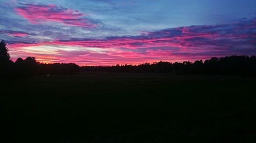 Silhouette of landscape against dramatic sky