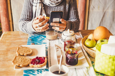 Midsection of man preparing food on table