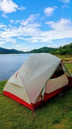 Tent on field against sky