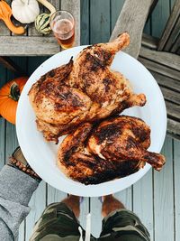 Low section of person with food on table