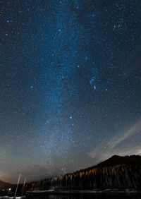 Scenic view of lake against star field at night