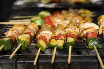 Close-up of meat and vegetables on barbecue grill