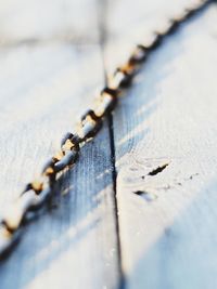 Rusty chain in early morning sunlight