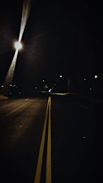 Illuminated road at night