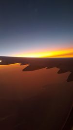 Scenic view of silhouette landscape against sky during sunset