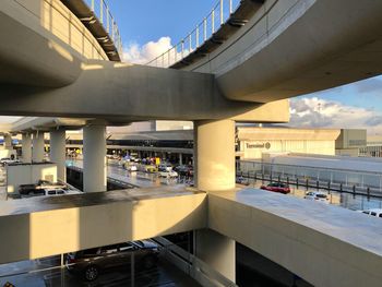 Bridge over buildings against sky in city