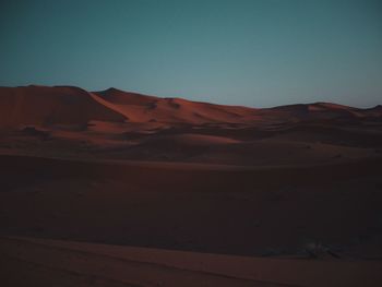 Scenic view of desert against clear sky