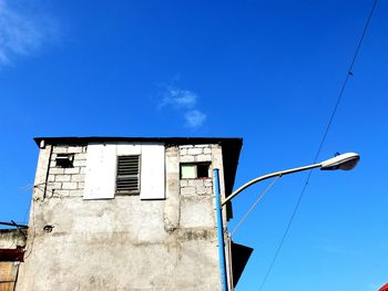 Low angle view of building against blue sky