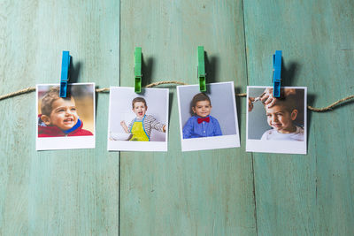 High angle view of photographs on wooden table