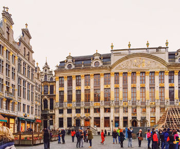 Group of people in front of buildings in city