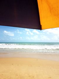 Scenic view of beach against sky