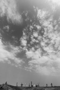 Low angle view of people on the beach