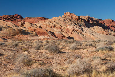 Scenic view of rocky mountains against clear sky