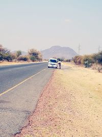 Car on road against mountain range