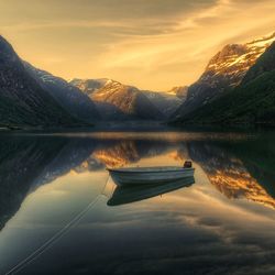 Scenic view of lake against sky during sunset