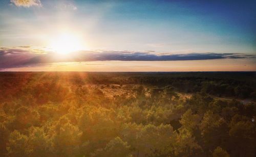 Scenic view of landscape against sky during sunset