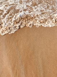 High angle view of surf on beach