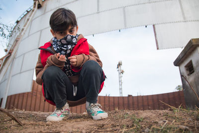 Portrait of little boy wearing face mask