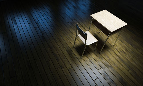 High angle view of empty chair and table on floor