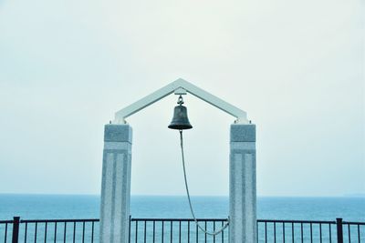 Pier on sea against clear sky
